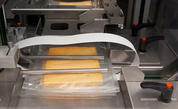Packaging dairy products by banding