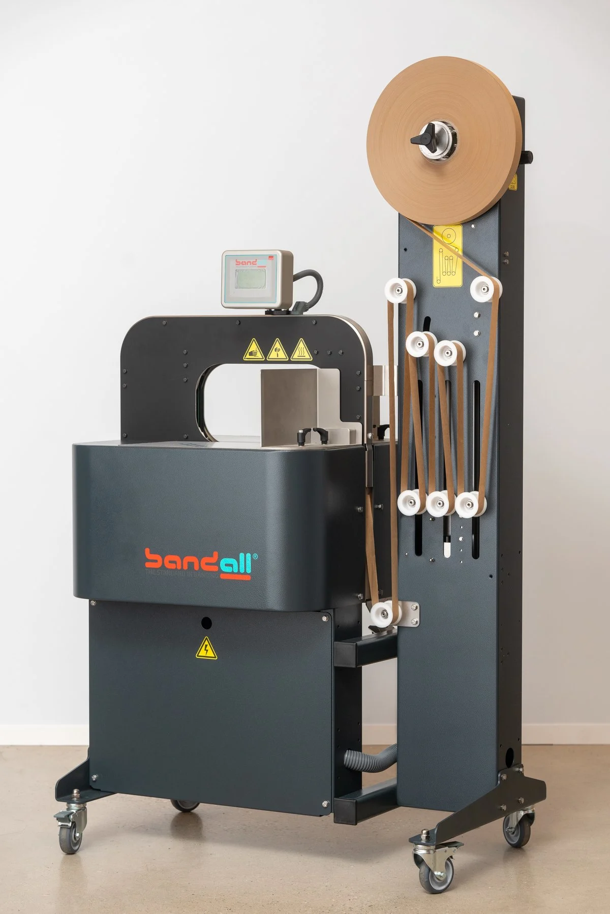 Entry stand alone banding machine with a paper band roll