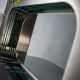 Banding machine uptime — the green belts inside the arch